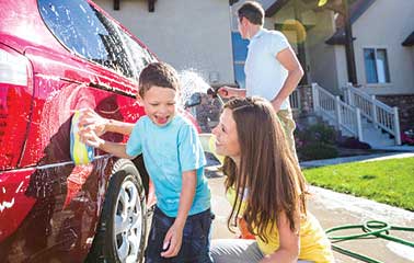 Image of children washing car